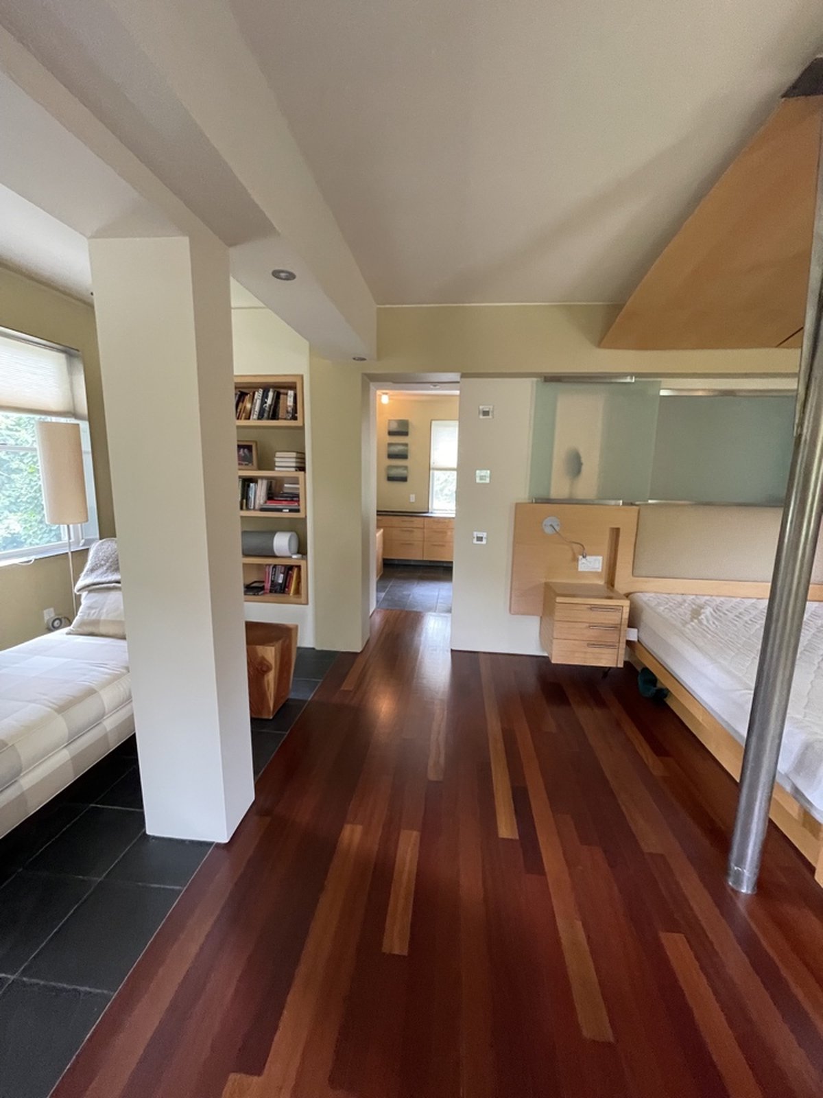 Multi-room master suite with hardwood floors, custom built-ins and soft warm tones