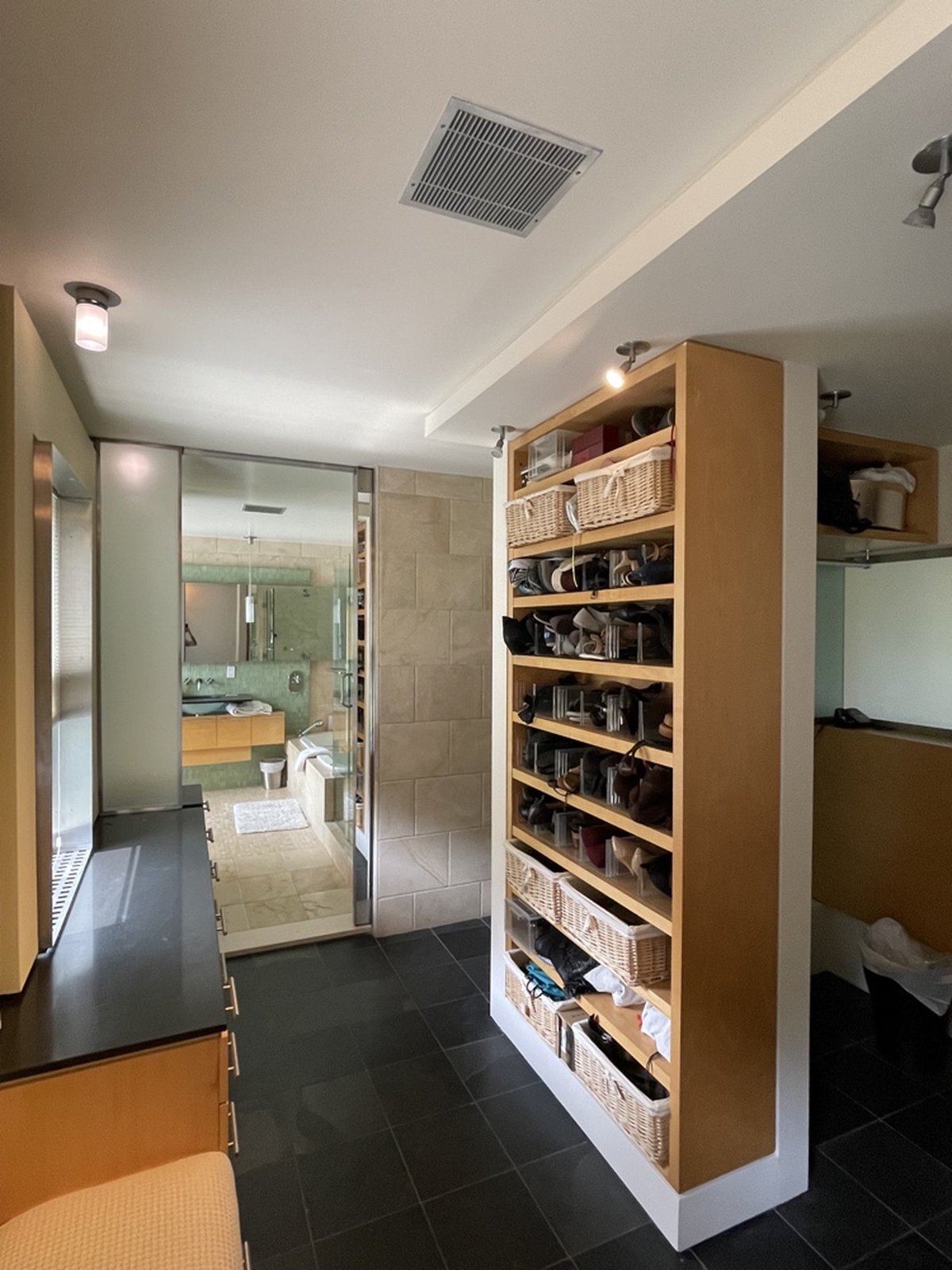 Spa-inspired bathroom with walk-in shower, custom shelving and neutral tones